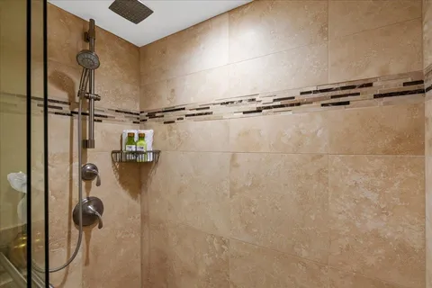 a view of a hallway with closet and wooden floor