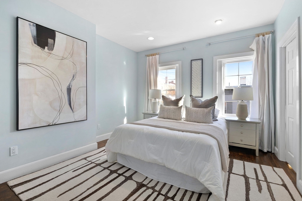 20 Sullivan Street, Unit 2 Boston, MA 02129 - Photo 16 of 25 a bedroom with a bed and a painting on the wall