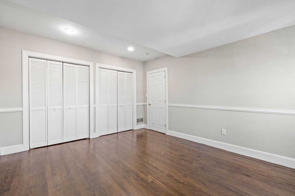 20 Sullivan Street, Unit 2 Boston, MA 02129 - Photo 19 of 25 a view of an empty room with wooden floor