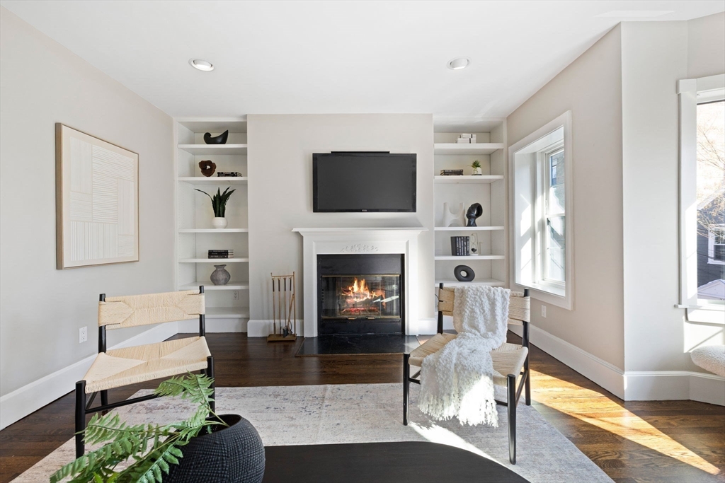 20 Sullivan Street, Unit 2 Boston, MA 02129 - Photo 3 of 25 a living room with furniture a flat screen tv and a fireplace
