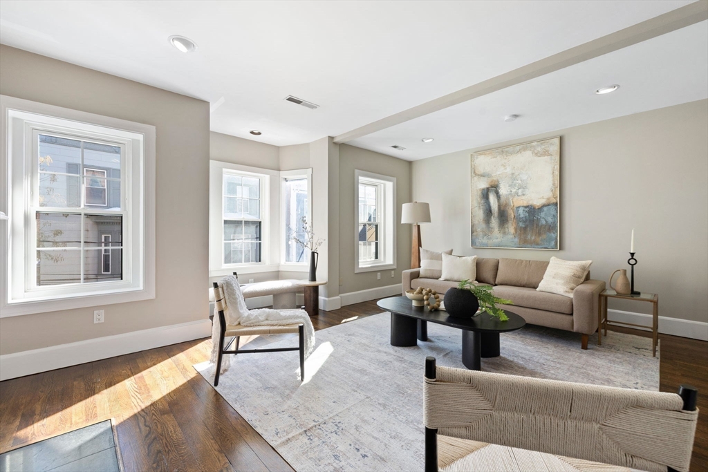 20 Sullivan Street, Unit 2 Boston, MA 02129 - Photo 6 of 25 a living room with furniture and floor to ceiling windows