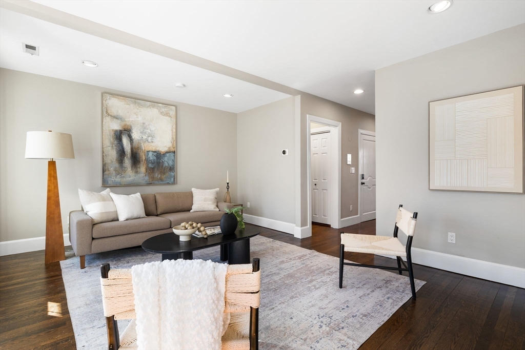 20 Sullivan Street, Unit 2 Boston, MA 02129 - Photo 7 of 25 a living room with furniture and a wooden floor