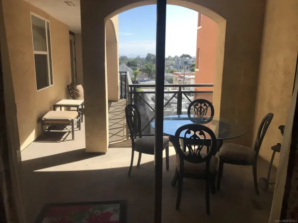 a view of a dining room with furniture window and outside view