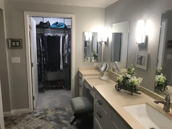 a bathroom with a sink double vanity and a mirror