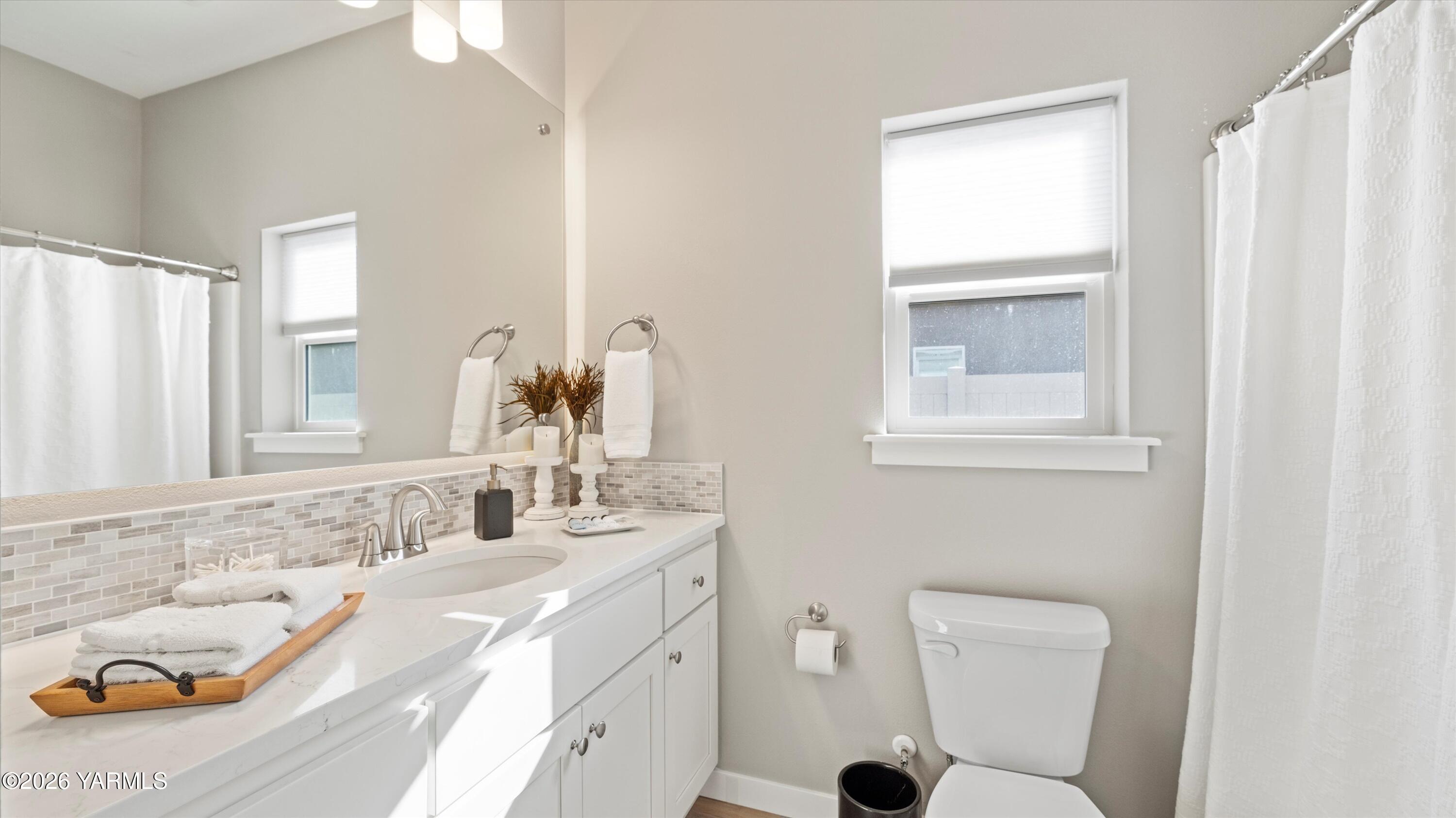208 Bratton Street Prosser, WA 99350 - Photo 21 of 36 a bathroom with a granite countertop sink and a mirror