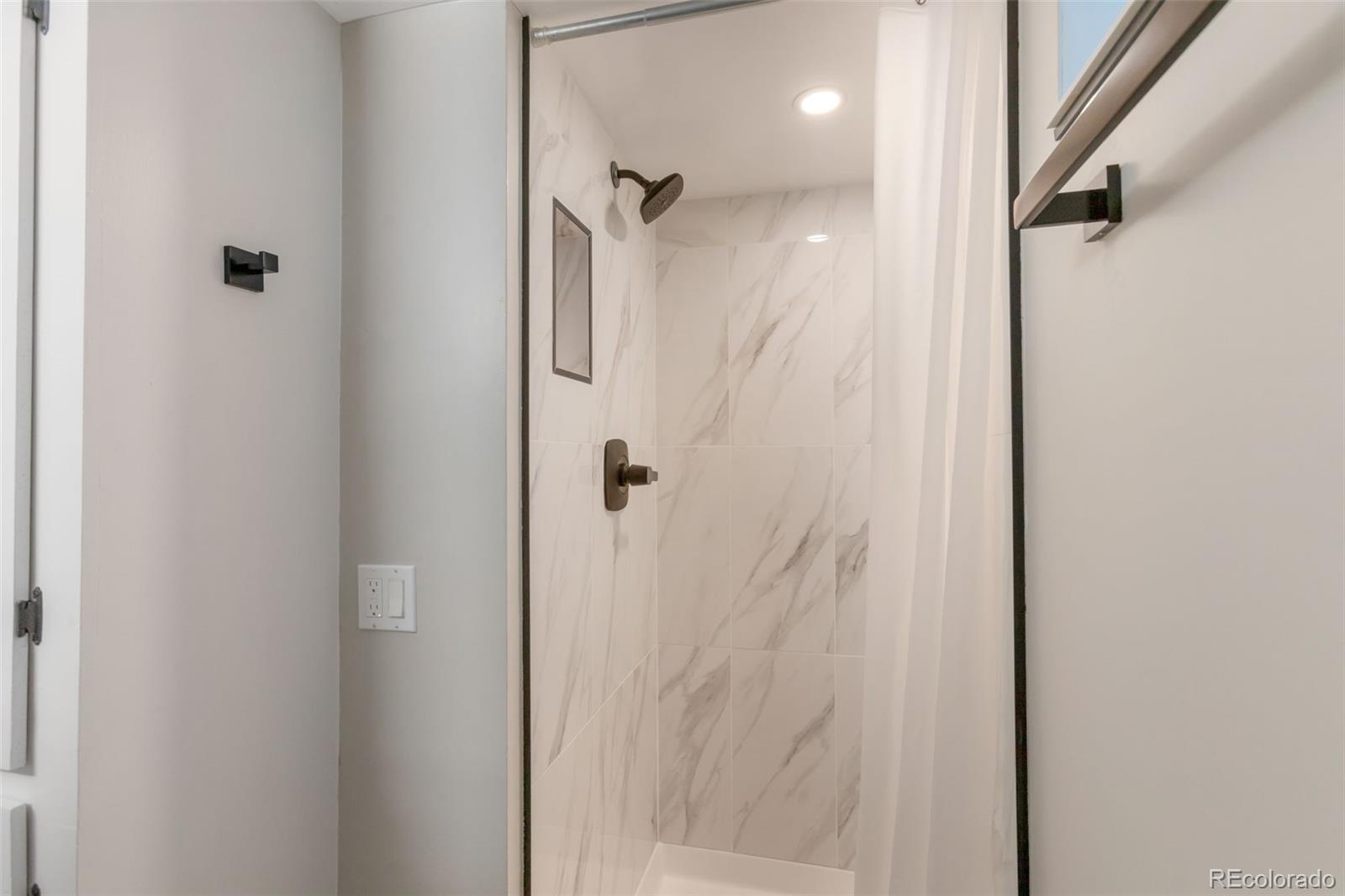 6221 South Logan Court Centennial, CO 80121 - Photo 21 of 30 a bathroom with a shower