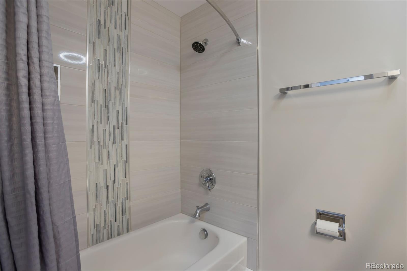 6221 South Logan Court Centennial, CO 80121 - Photo 22 of 30 a bathroom with a tub