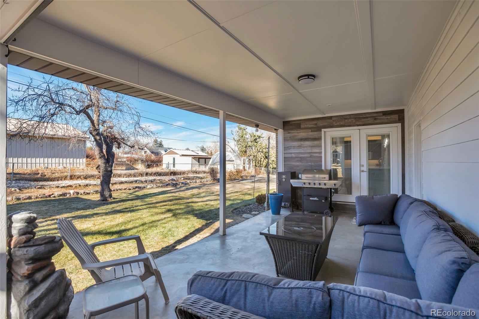 6221 South Logan Court Centennial, CO 80121 - Photo 28 of 30 a living room with furniture and a large window