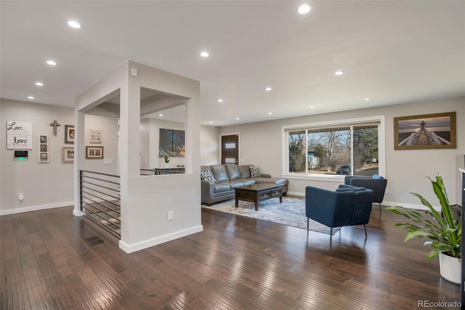 6221 South Logan Court Centennial, CO 80121 - Photo 10 of 30 a living room with furniture and a wooden floor