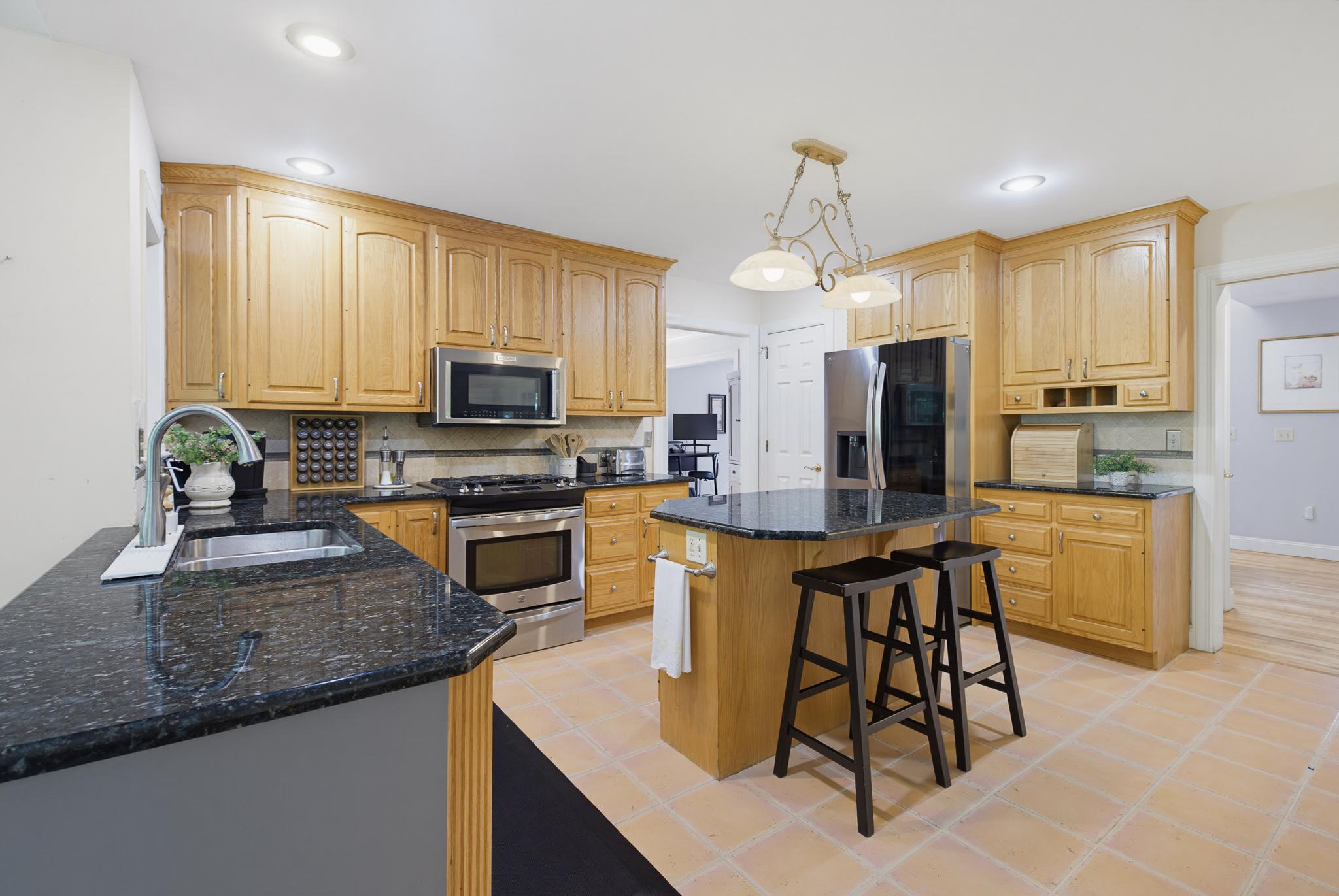 3276 Verdant Grove Lancaster, PA 17601 - Photo 15 of 50 Kitchen Granite counters & terracotta tile floors