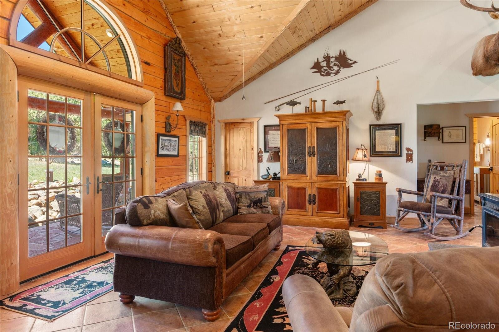 234 Bremer Road Howard, CO 81233 - Photo 11 of 50 a living room with furniture and large windows