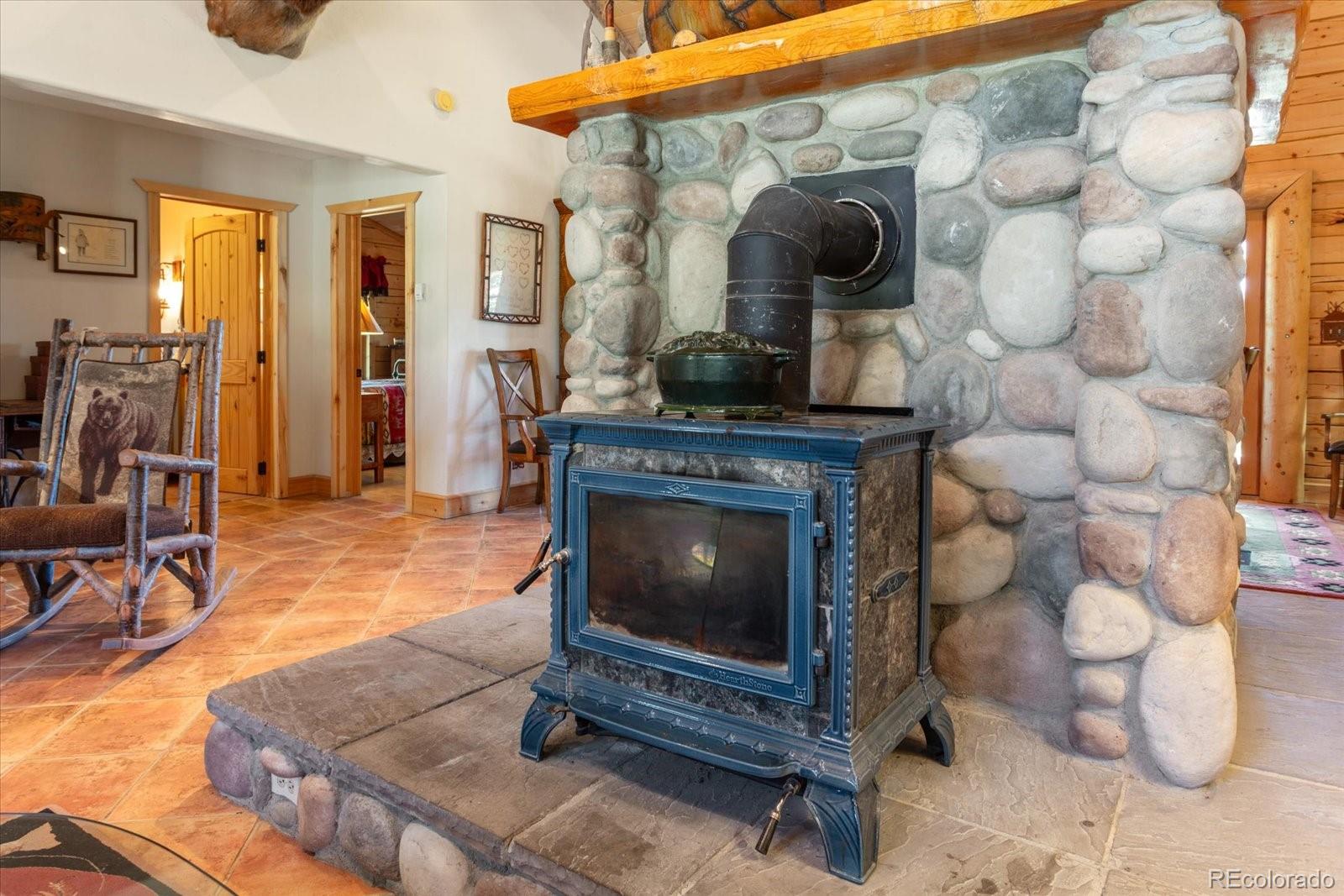 234 Bremer Road Howard, CO 81233 - Photo 12 of 50 a living room with furniture and a fireplace