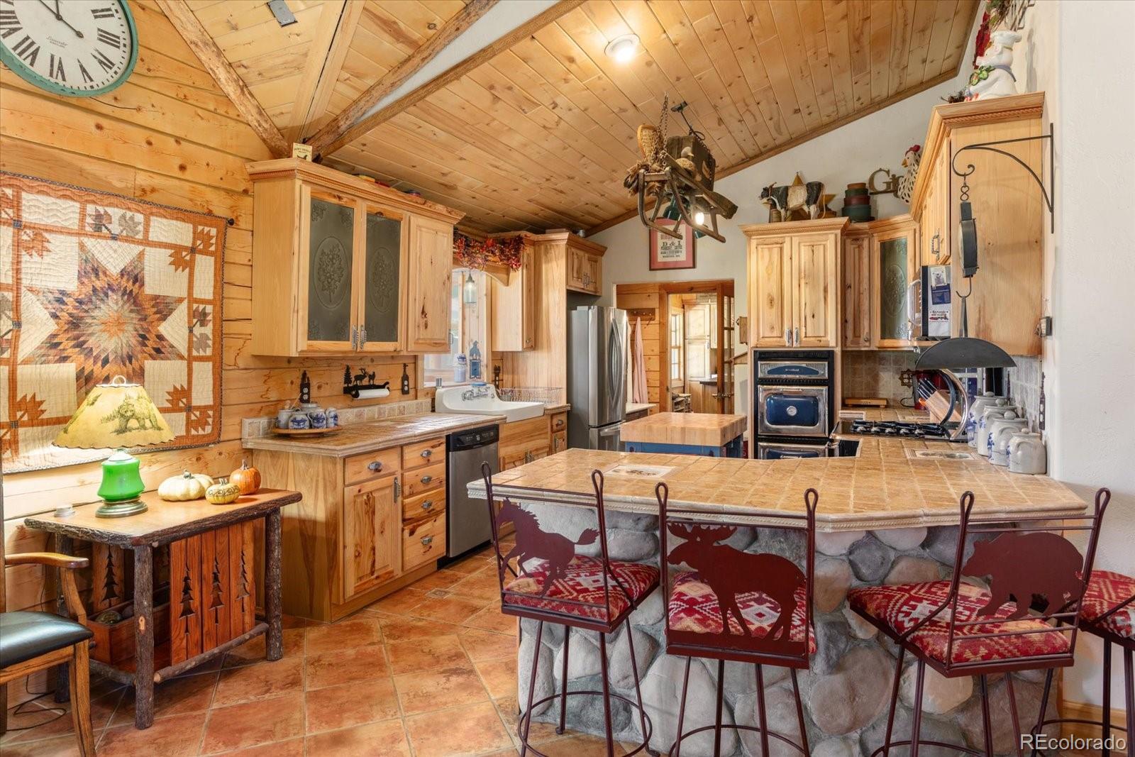 234 Bremer Road Howard, CO 81233 - Photo 15 of 50 a large kitchen with a table and chairs