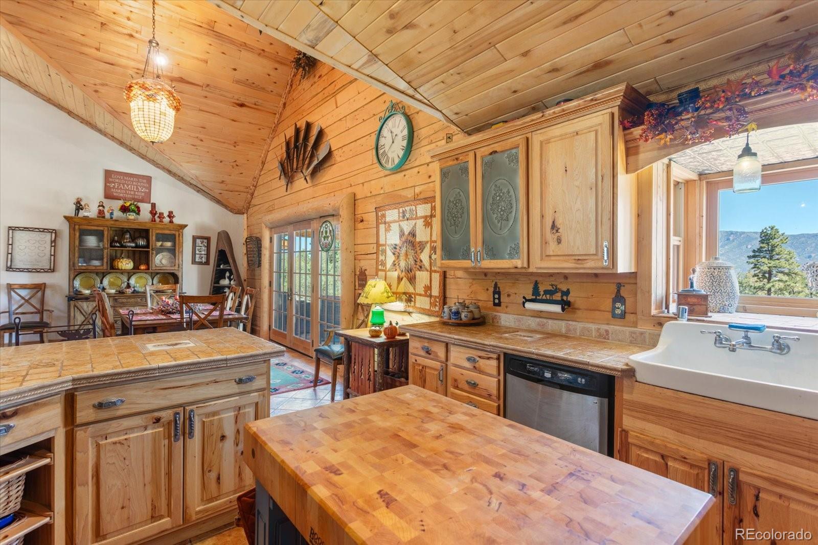 234 Bremer Road Howard, CO 81233 - Photo 18 of 50 a large kitchen with stainless steel appliances granite countertop a sink and cabinets