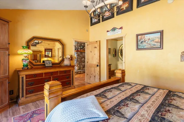 a bathroom with a toilet a sink and a mirror