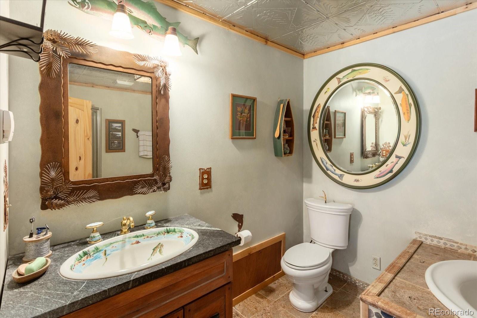 234 Bremer Road Howard, CO 81233 - Photo 23 of 50 a bathroom with a toilet a sink and a mirror