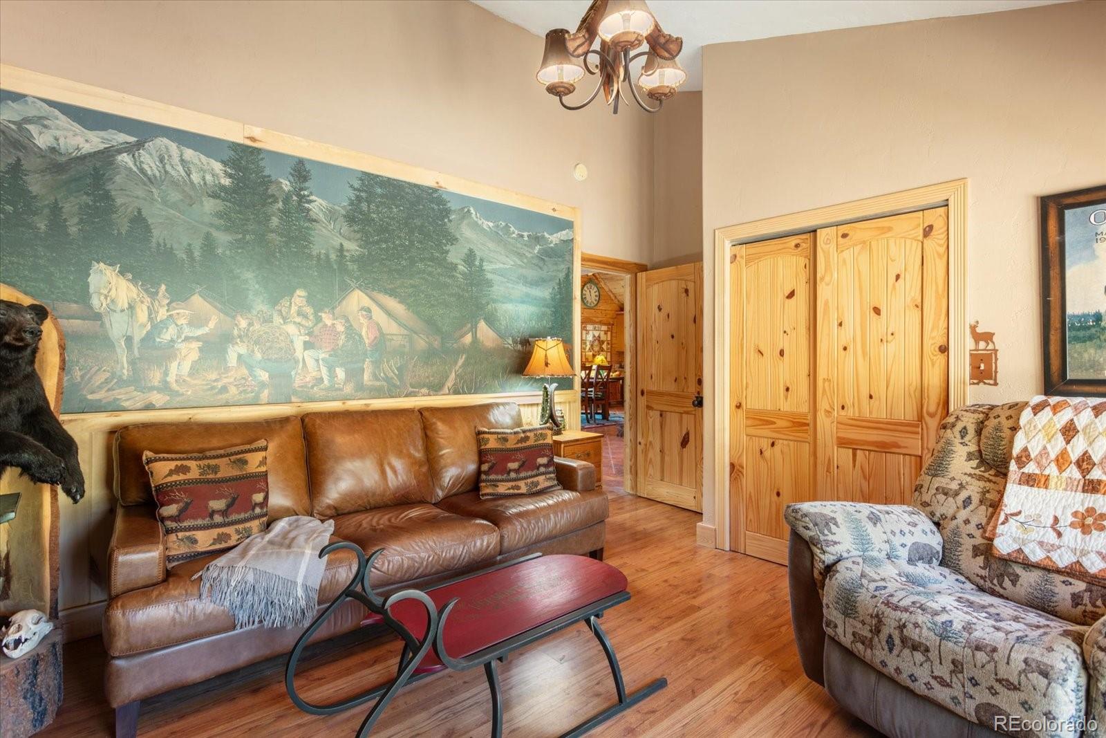 234 Bremer Road Howard, CO 81233 - Photo 27 of 50 a living room with furniture and wooden floor