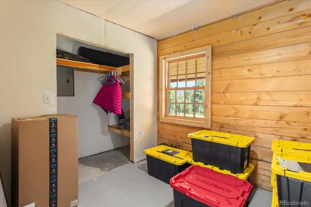 a view of a yard with wooden fence