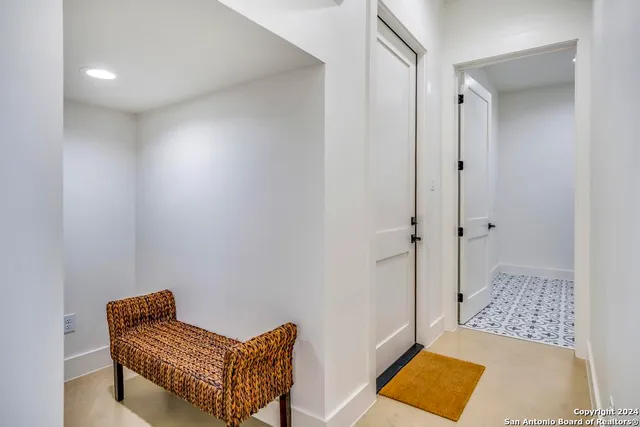a living room with furniture and a rug