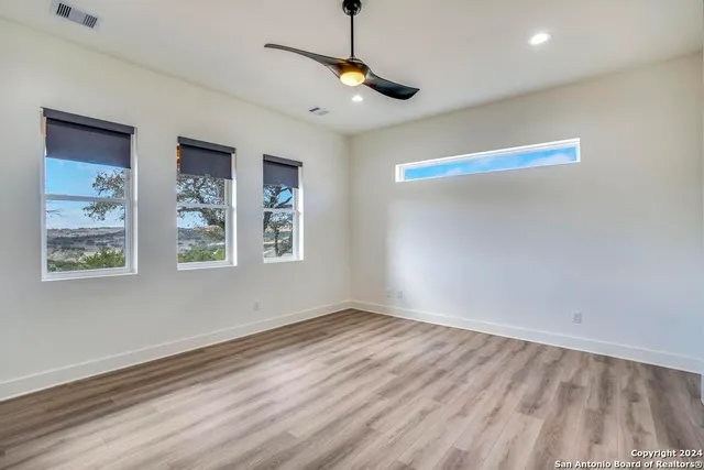 a view of room with window and ceiling fan