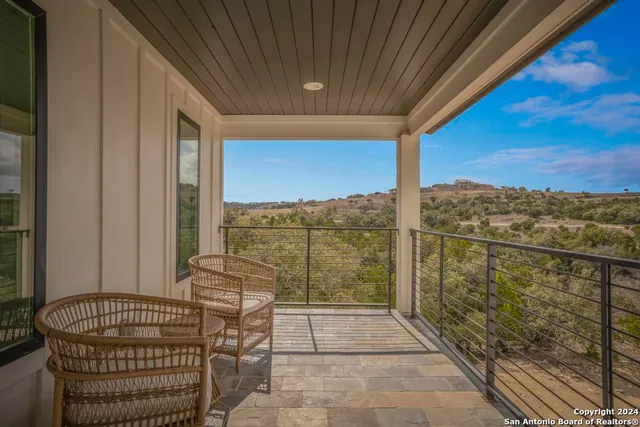 a view of balcony with furniture