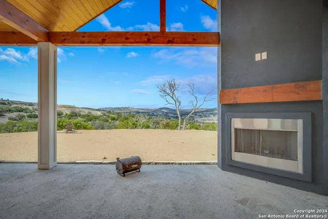 a view of an empty room with a fireplace