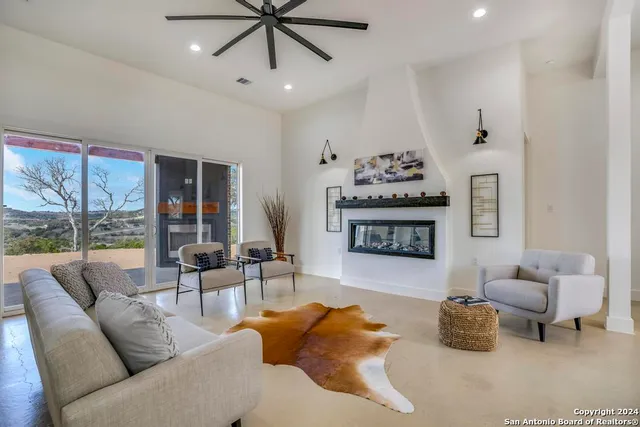 a living room with furniture and a large window