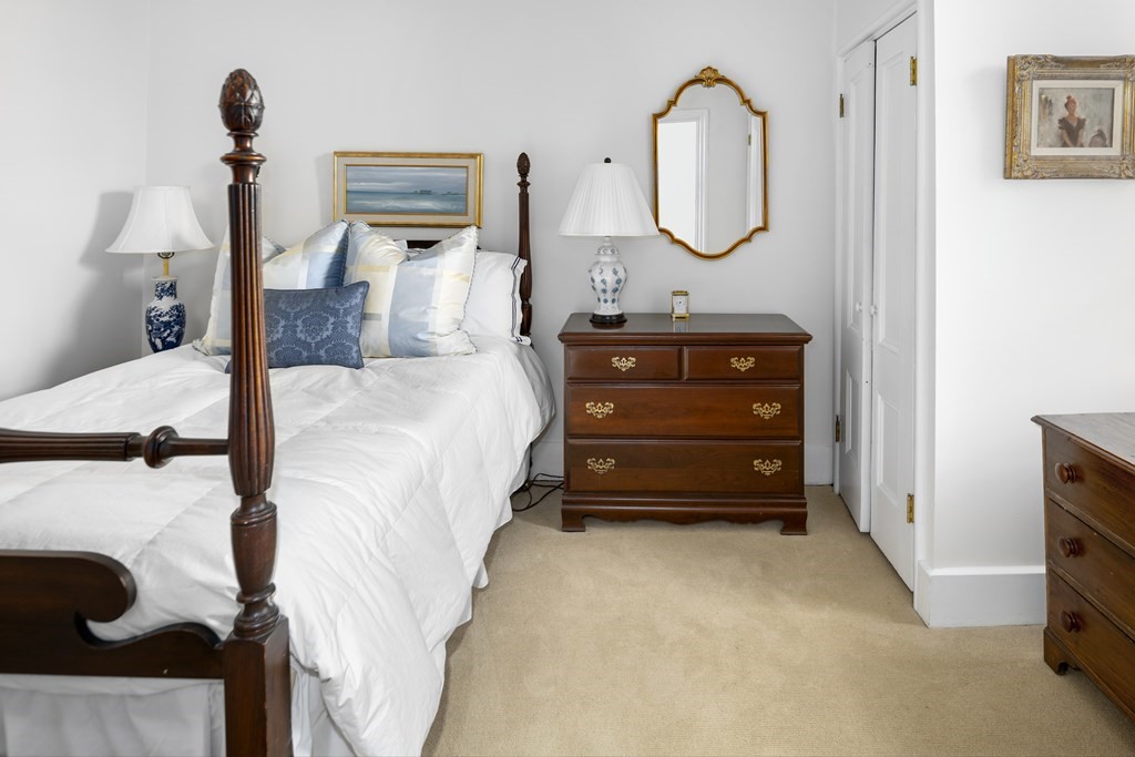 1 Otis Place Boston, MA 02108 - Photo 15 of 22 a bedroom with a bed and a mirror