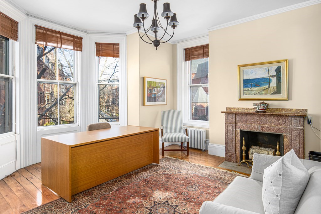 1 Otis Place Boston, MA 02108 - Photo 19 of 22 a living room with furniture and a fireplace