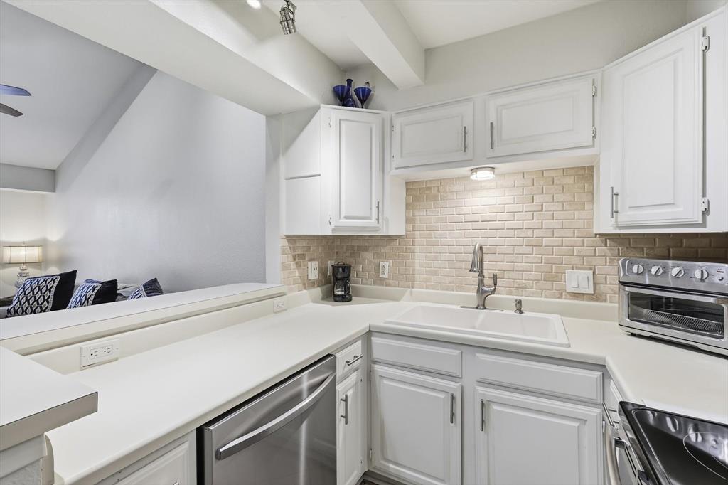 2505 Shady Ridge Drive Bedford, TX 76021 - Photo 5 of 15 a kitchen with a sink cabinets and appliances