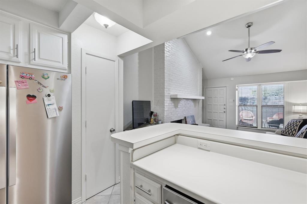 2505 Shady Ridge Drive Bedford, TX 76021 - Photo 6 of 15 a kitchen with a refrigerator sink and cabinets