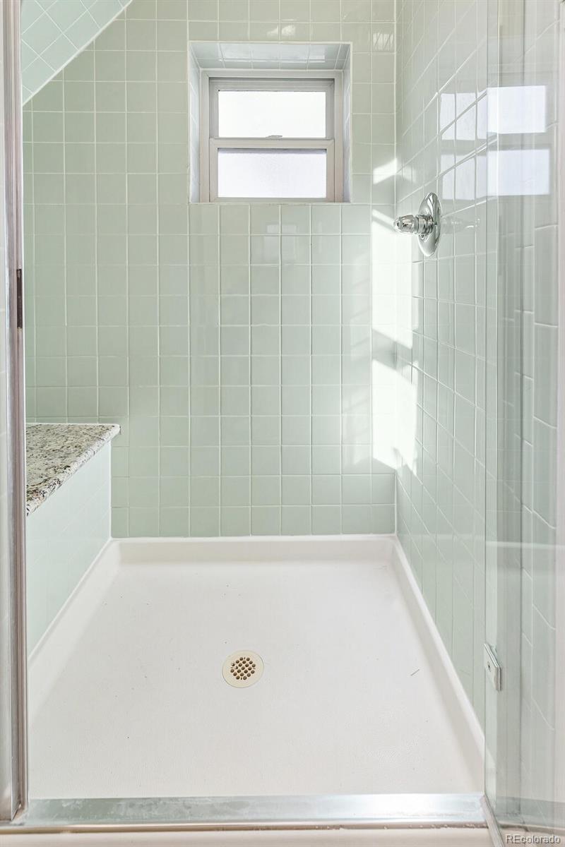 3885 Wolff Street Denver, CO 80212 - Photo 27 of 50 a bathroom with a bathtub