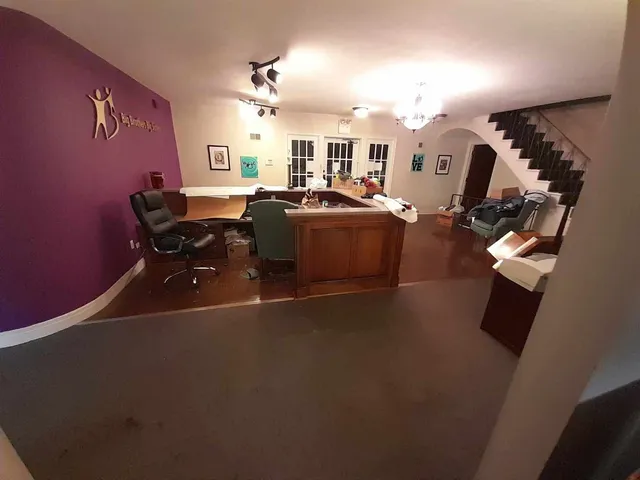 a living room with furniture window and flat screen tv