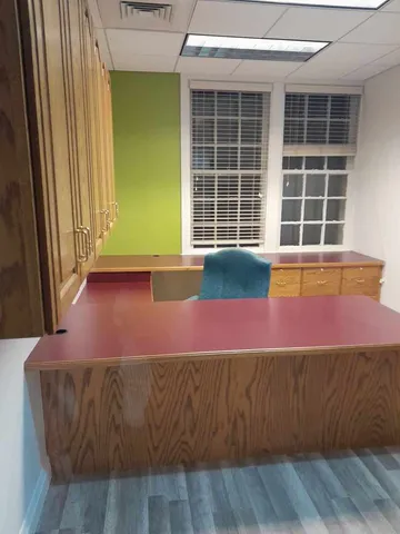 a bed room with a bed and a window