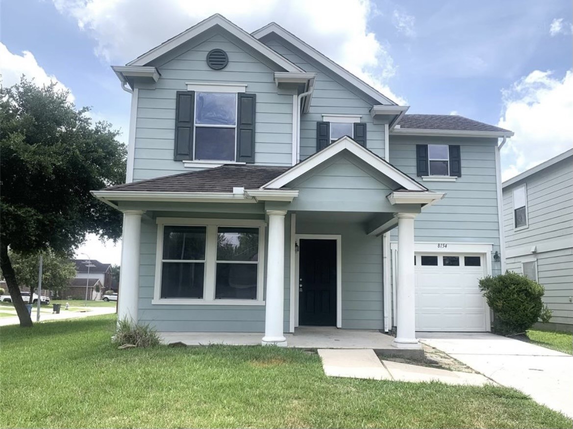 8154 Arrington Forest Lane Humble, TX 77338 - Photo 1 of 10 a front view of a house with a yard