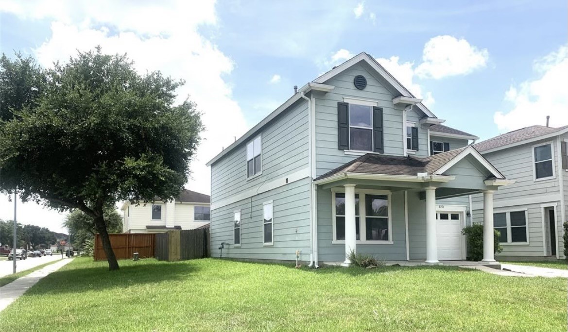 8154 Arrington Forest Lane Humble, TX 77338 - Photo 2 of 10 a front view of a house with a yard