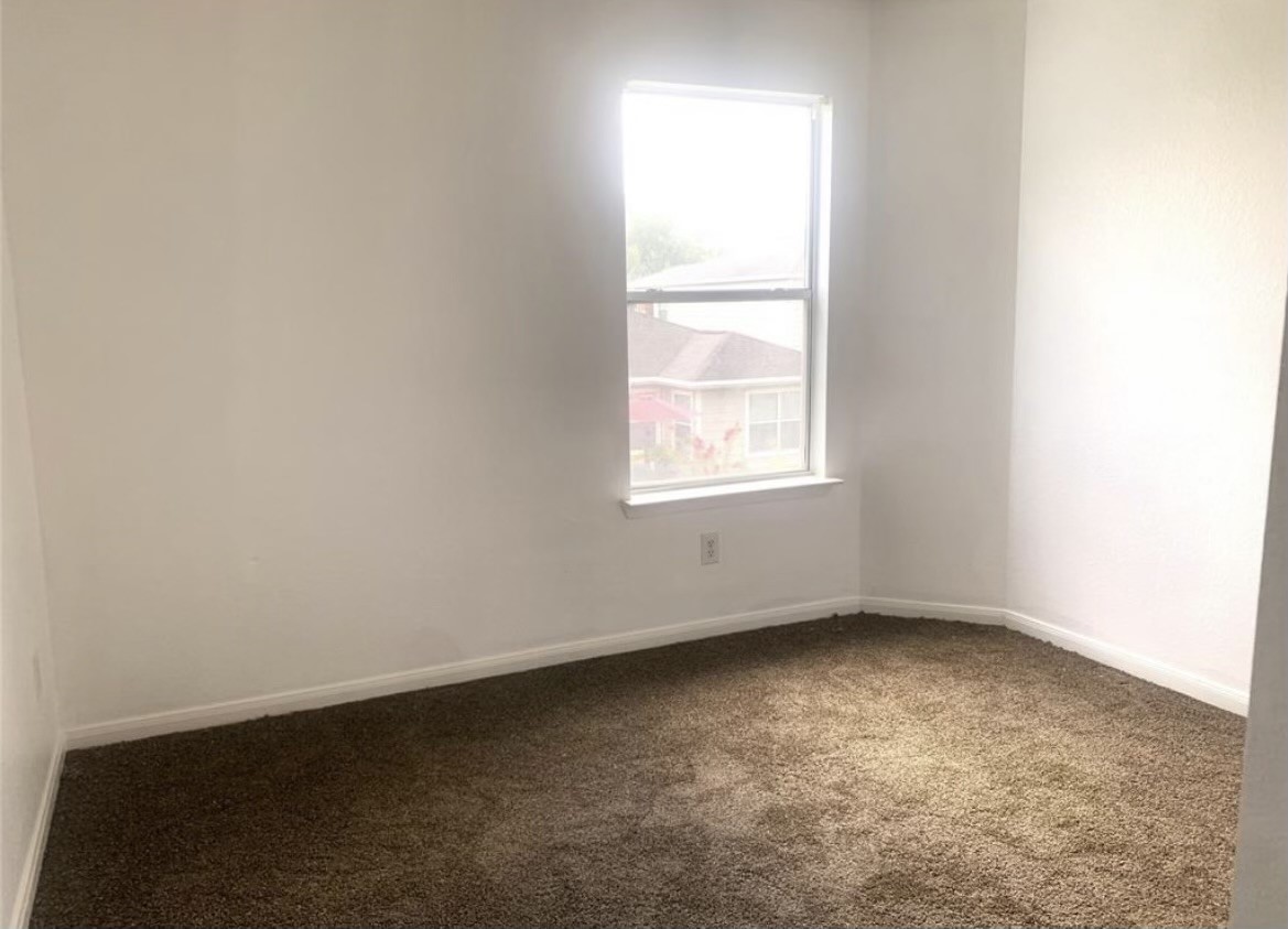 8154 Arrington Forest Lane Humble, TX 77338 - Photo 8 of 10 an empty room with a window