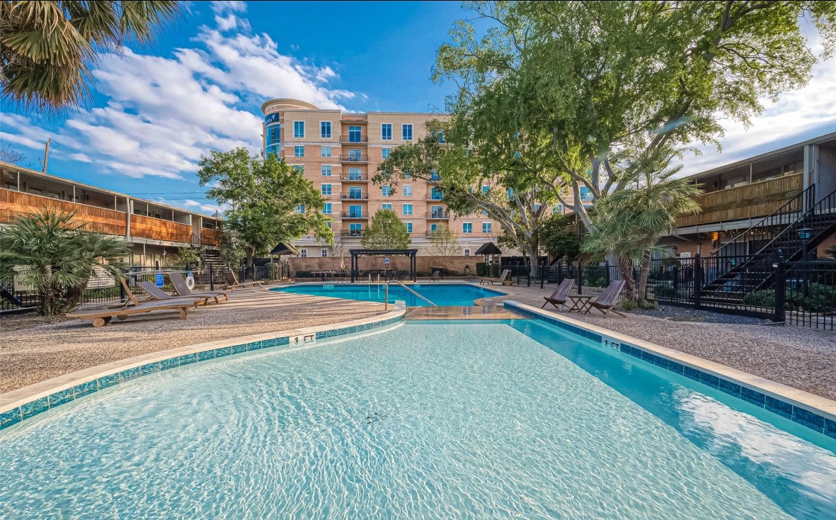 3942 West Alabama Street, Unit 5 Houston, TX 77027 - Photo 1 of 28 a view of a swimming pool with a patio