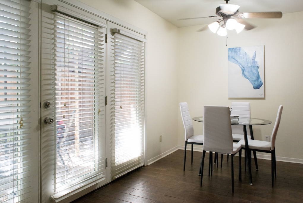 3942 West Alabama Street, Unit 5 Houston, TX 77027 - Photo 11 of 28 a view of a dining room with furniture and wooden floor