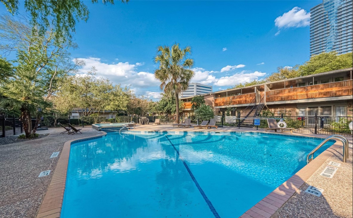 3942 West Alabama Street, Unit 5 Houston, TX 77027 - Photo 20 of 28 a view of a swimming pool with outdoor seating