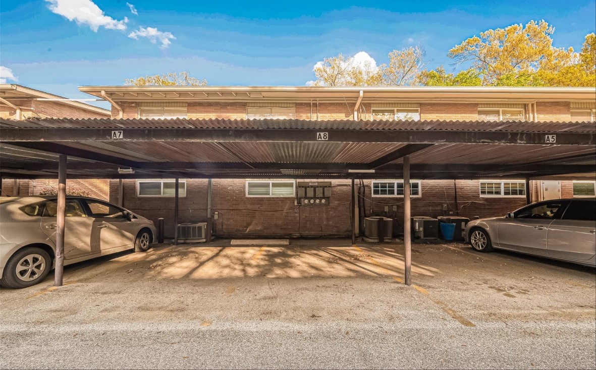 3942 West Alabama Street, Unit 5 Houston, TX 77027 - Photo 22 of 28 a view of parking garage with cars