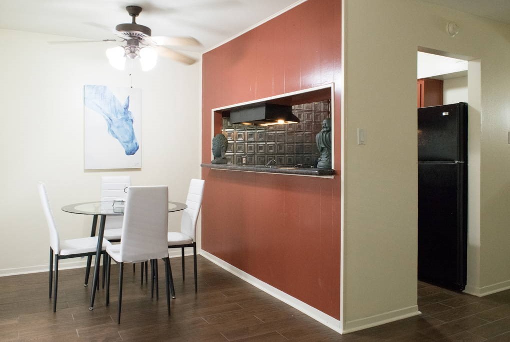 3942 West Alabama Street, Unit 5 Houston, TX 77027 - Photo 10 of 28 a view of a dining room with furniture and wooden floor