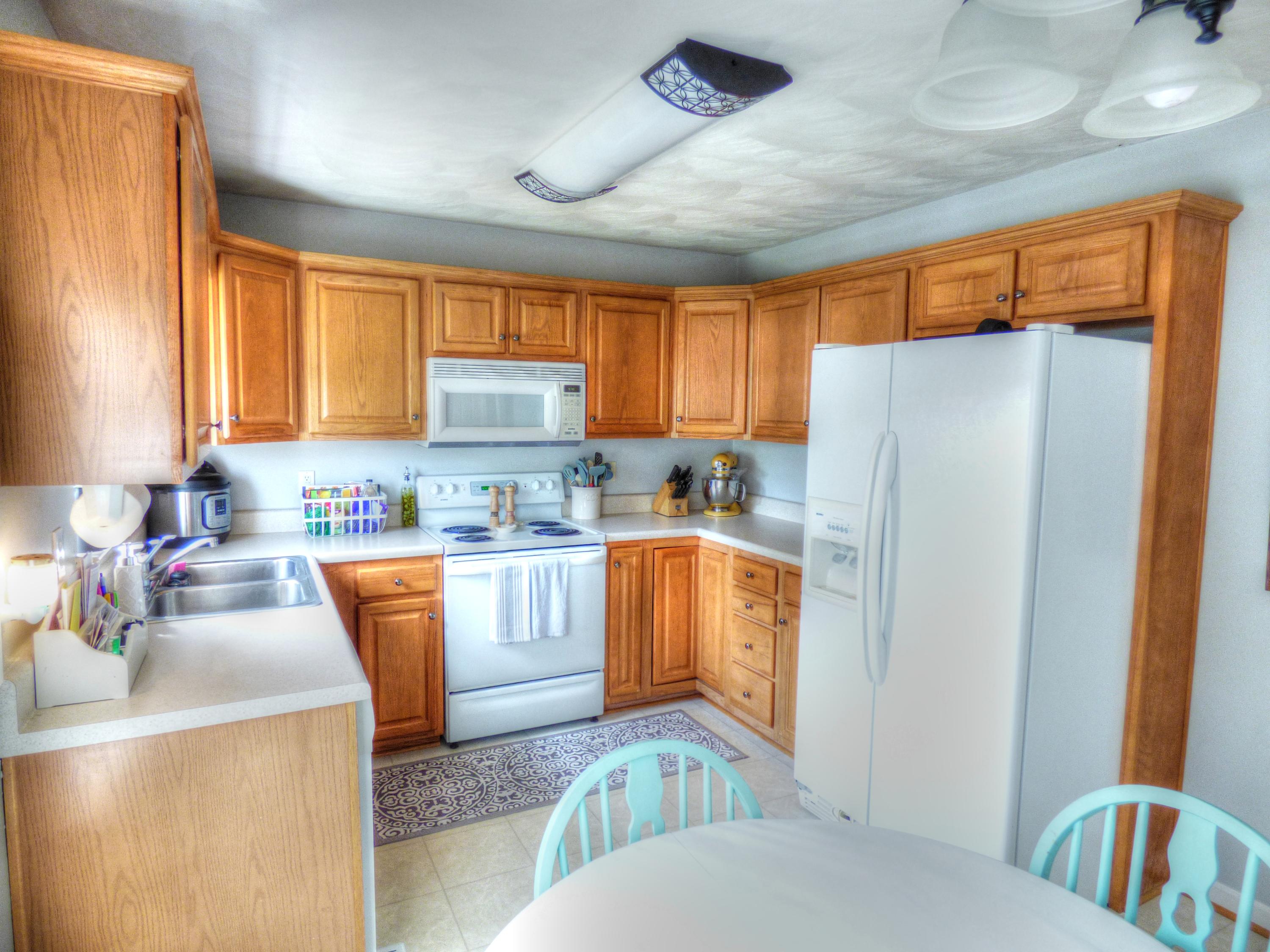819 Ruddell Road Vinton, VA 24179 - Photo 12 of 22 a kitchen with stainless steel appliances granite countertop a refrigerator a sink dishwasher a stove with wooden cabinets and floor
