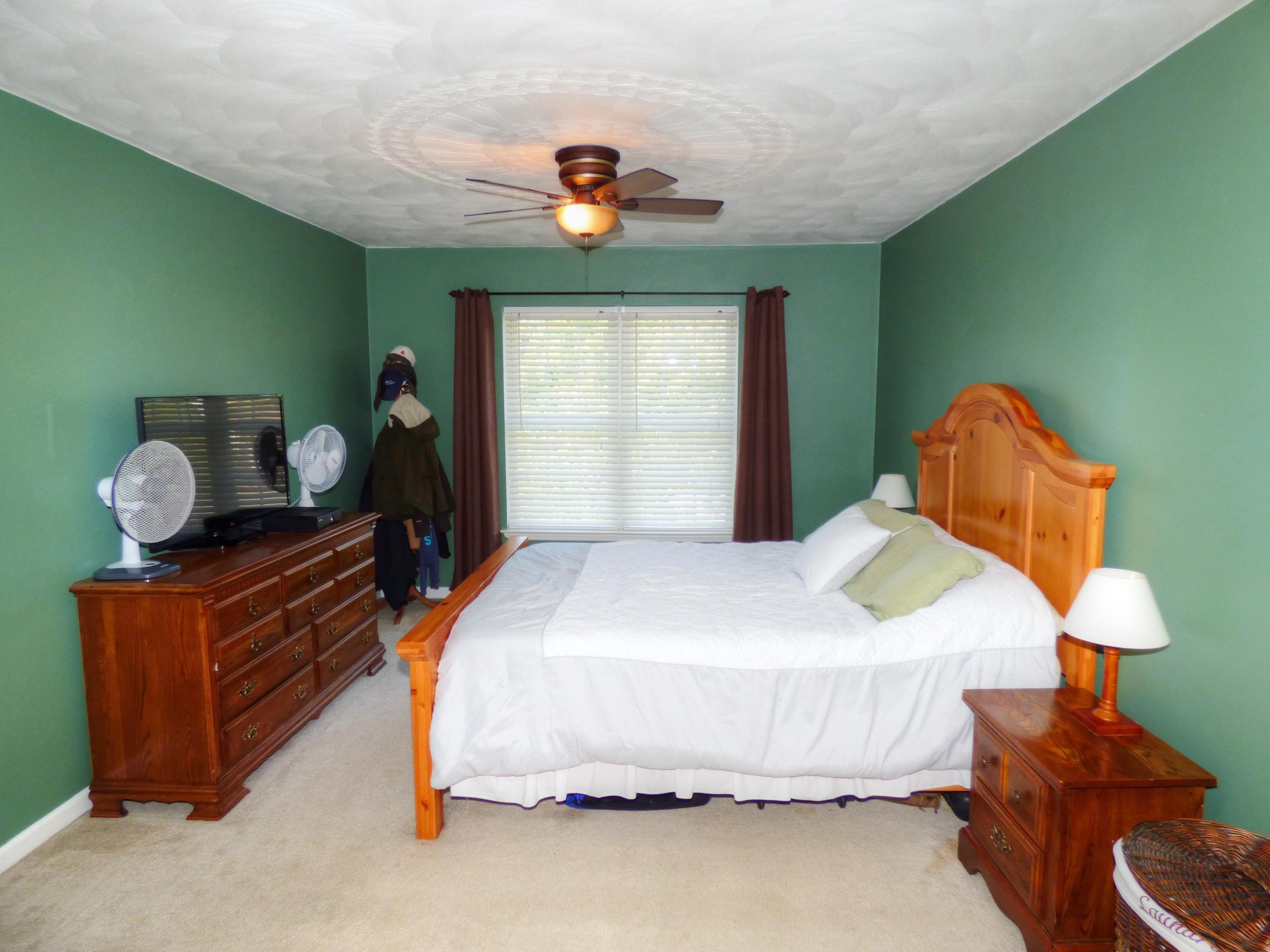 819 Ruddell Road Vinton, VA 24179 - Photo 13 of 22 a bedroom with a bed and window