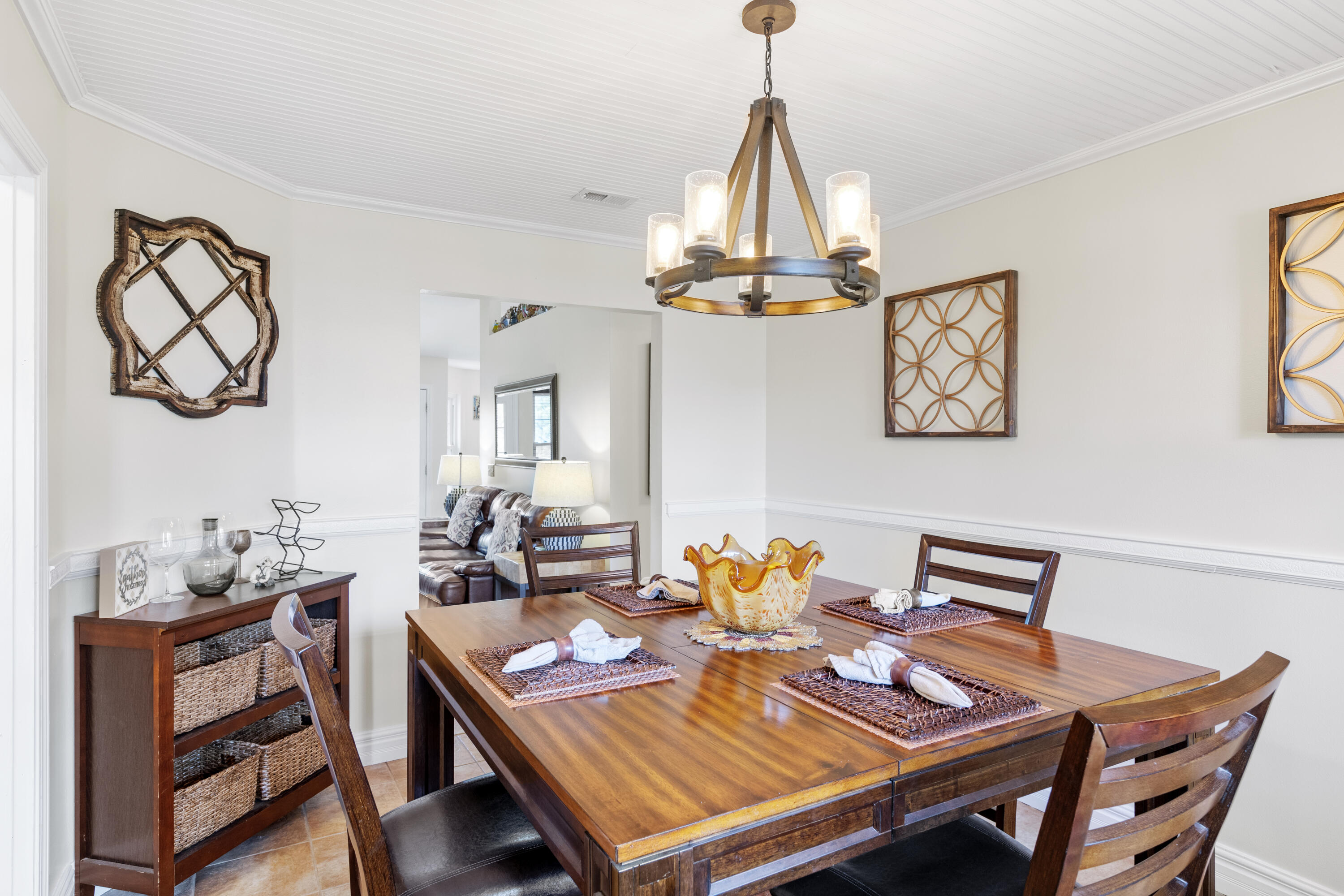 2852 Atoka Trail Crestview, FL 32539 - Photo 19 of 45 a view of a dining room with furniture a chandelier and wooden floor