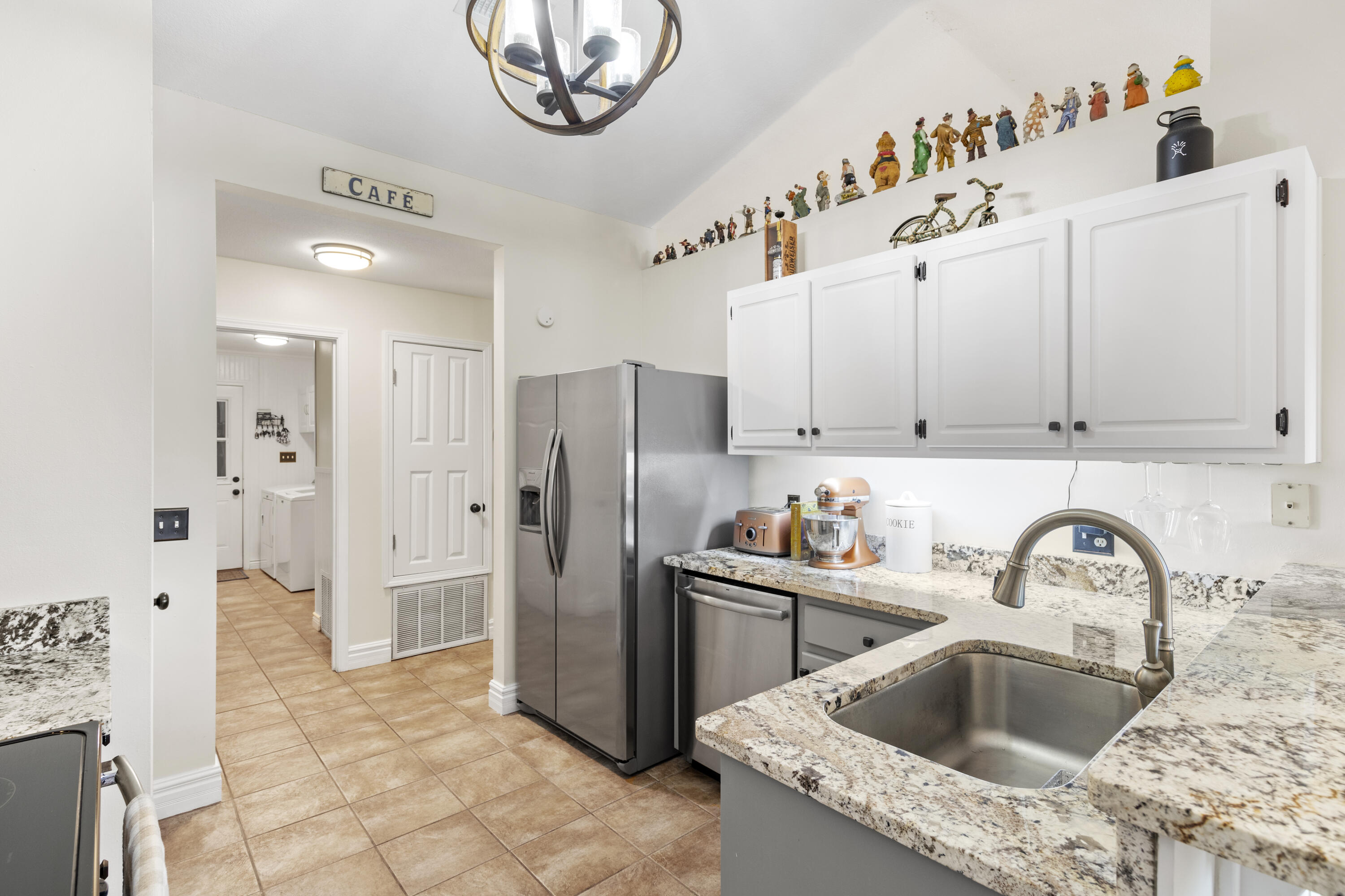 2852 Atoka Trail Crestview, FL 32539 - Photo 20 of 45 a kitchen with stainless steel appliances granite countertop a sink and a refrigerator