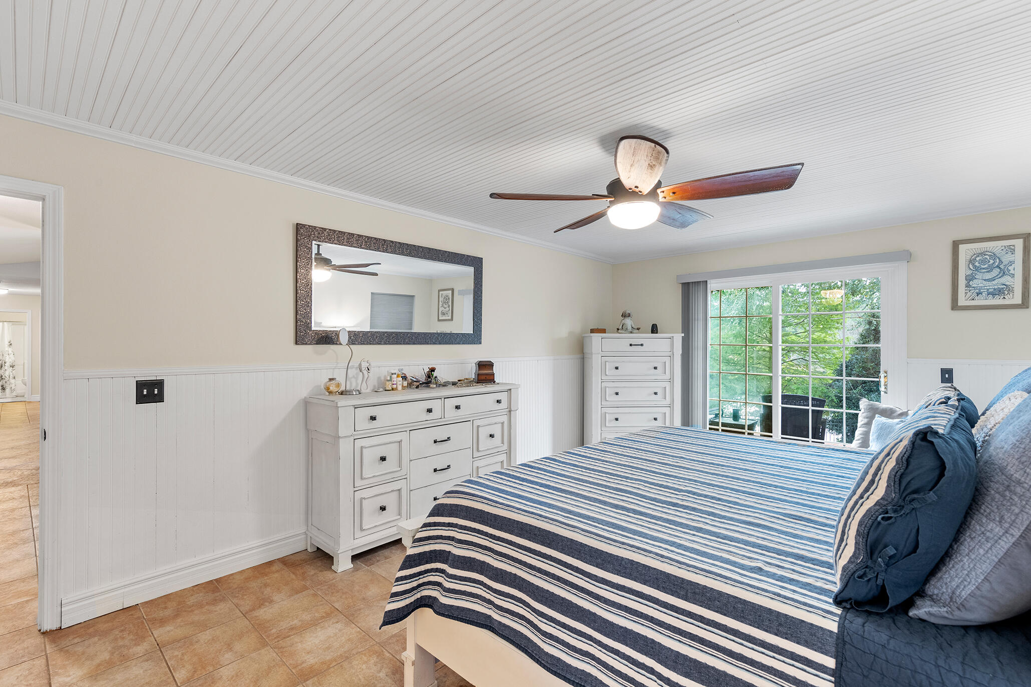 2852 Atoka Trail Crestview, FL 32539 - Photo 28 of 45 a bedroom with a bed and a chandelier