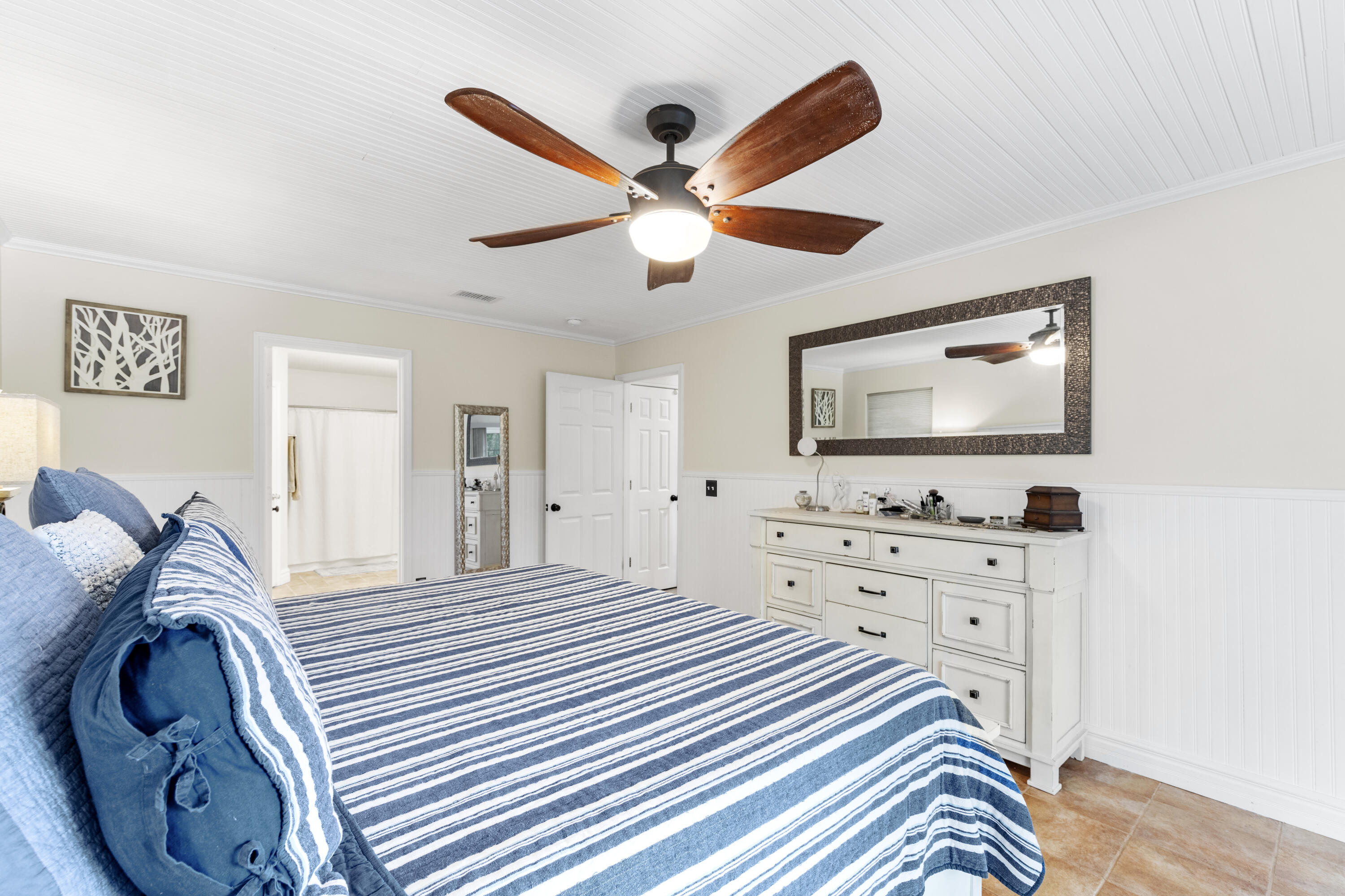 2852 Atoka Trail Crestview, FL 32539 - Photo 29 of 45 a bedroom with a bed and a flat screen tv