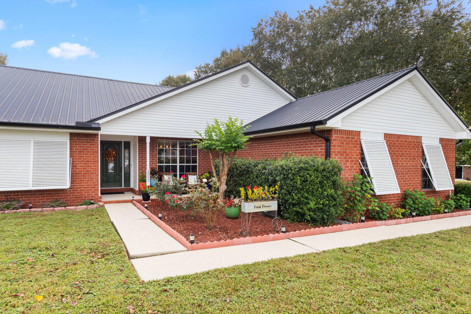 2852 Atoka Trail Crestview, FL 32539 - Photo 4 of 45 a front view of house with yard and outdoor seating
