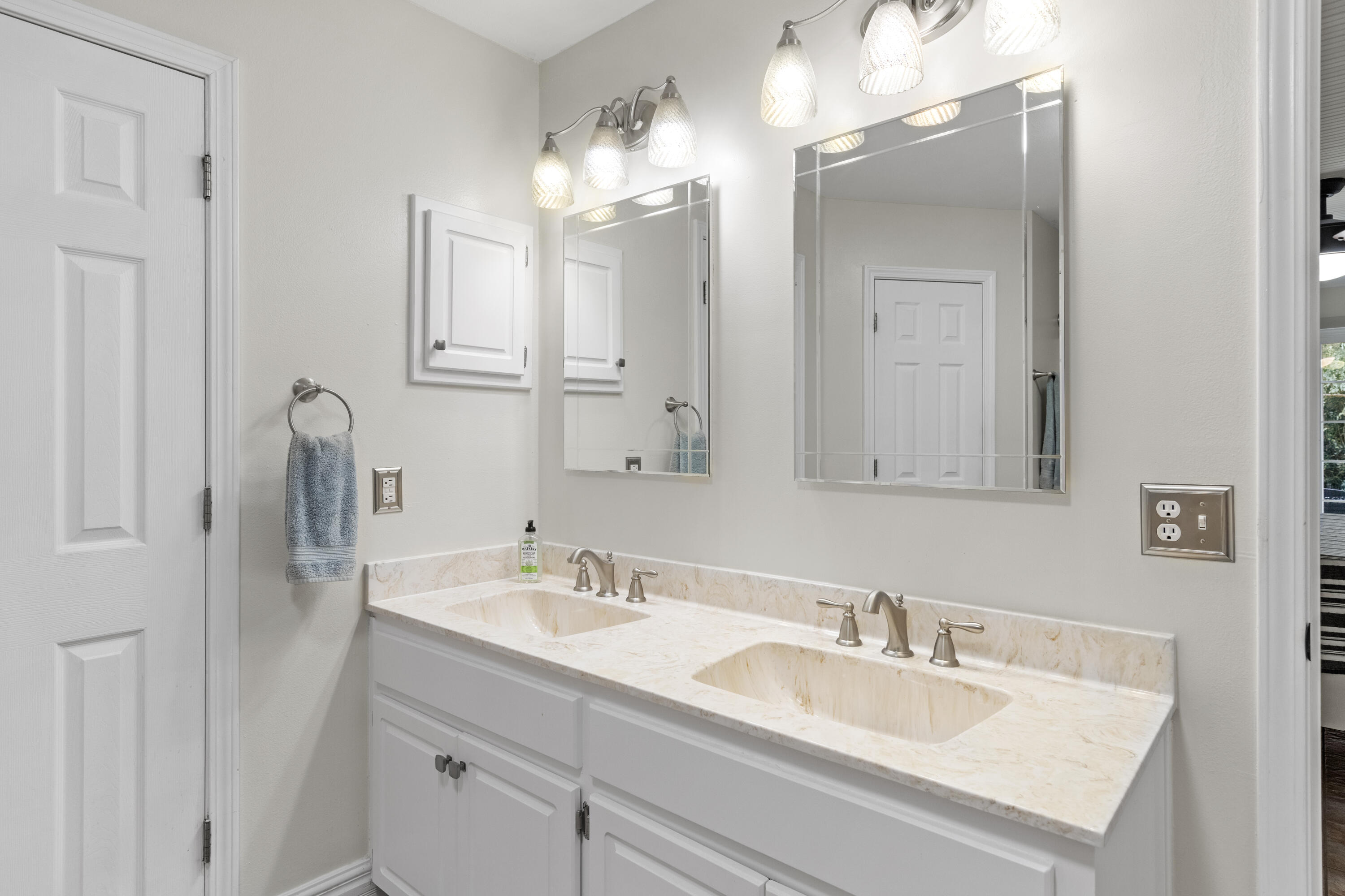 2852 Atoka Trail Crestview, FL 32539 - Photo 31 of 45 a bathroom with double vanity sinks and a mirror